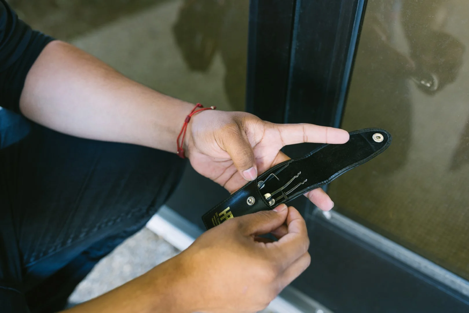 Technician working on a storefront glass door